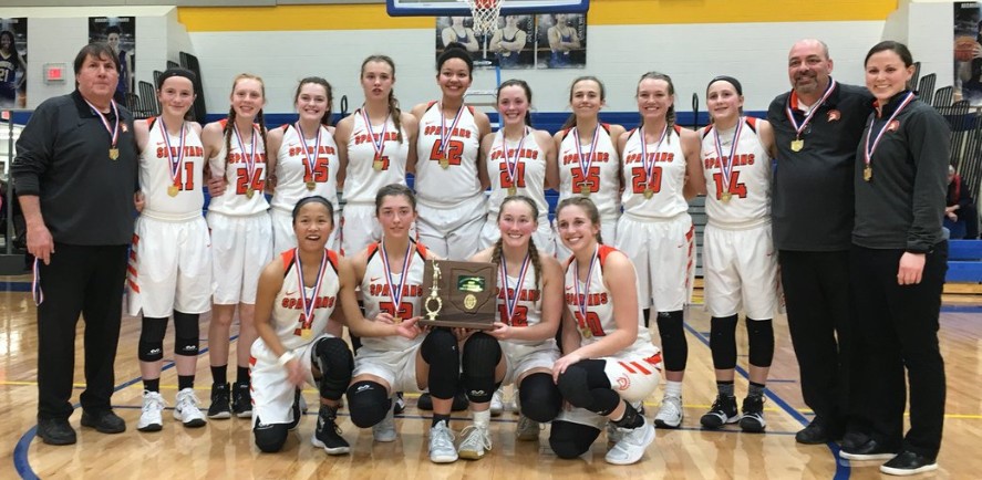 girls basketball team with trophy plaque and medals